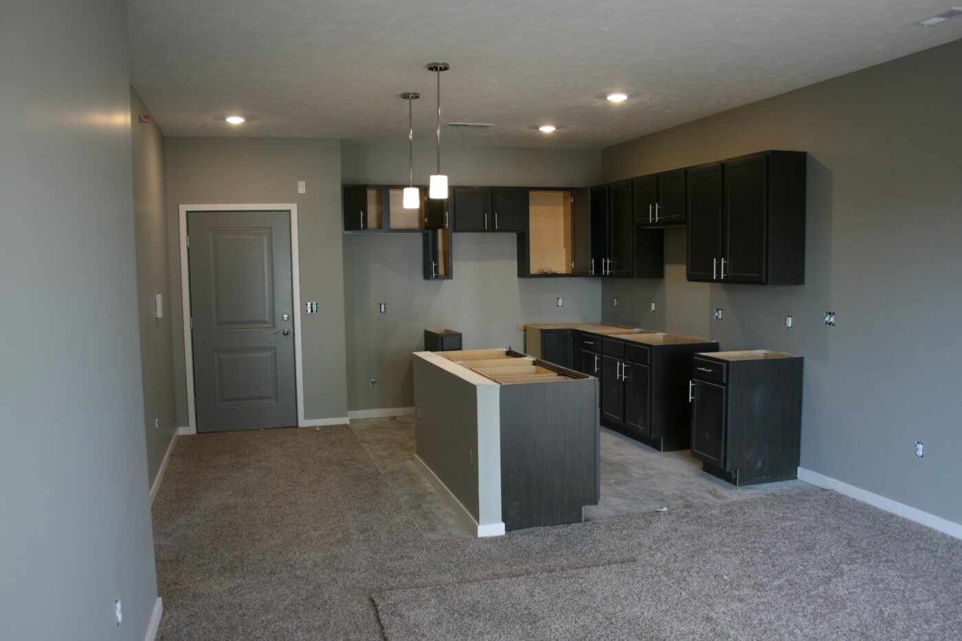 Apartment Door and Kitchen Under Construction